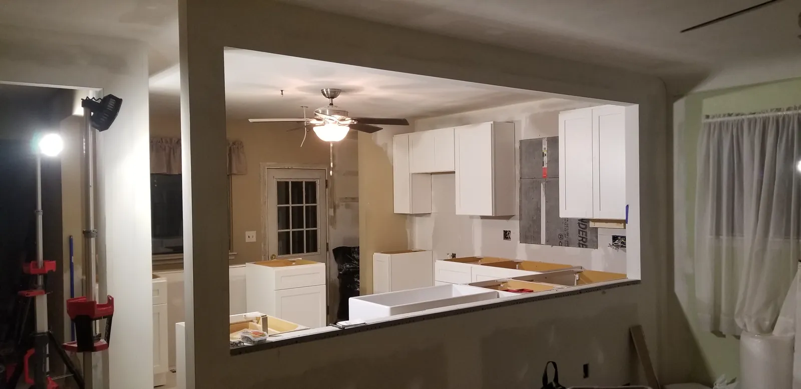 The finished Garden City kitchen with white shaker cabinets and new flooring