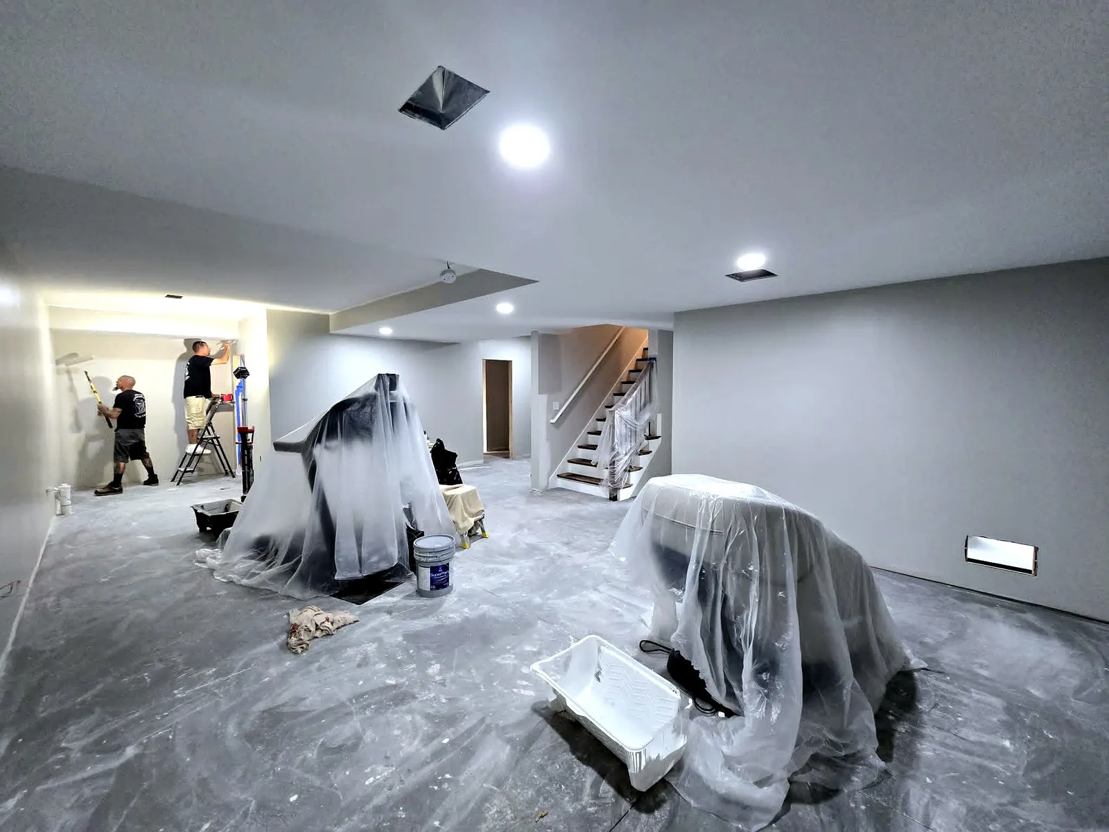 The finished Plymouth basement with plank flooring and recessed lighting