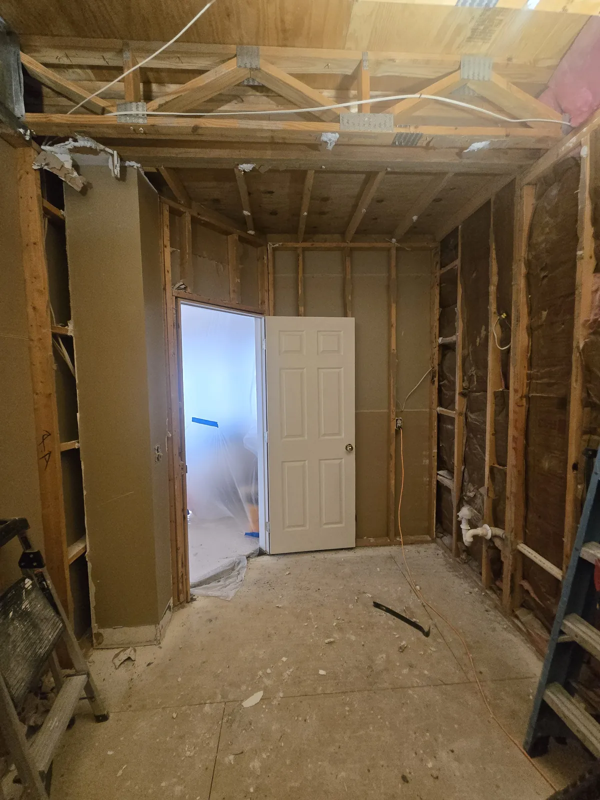 Bathroom taken to the studs with fresh framing and insulation